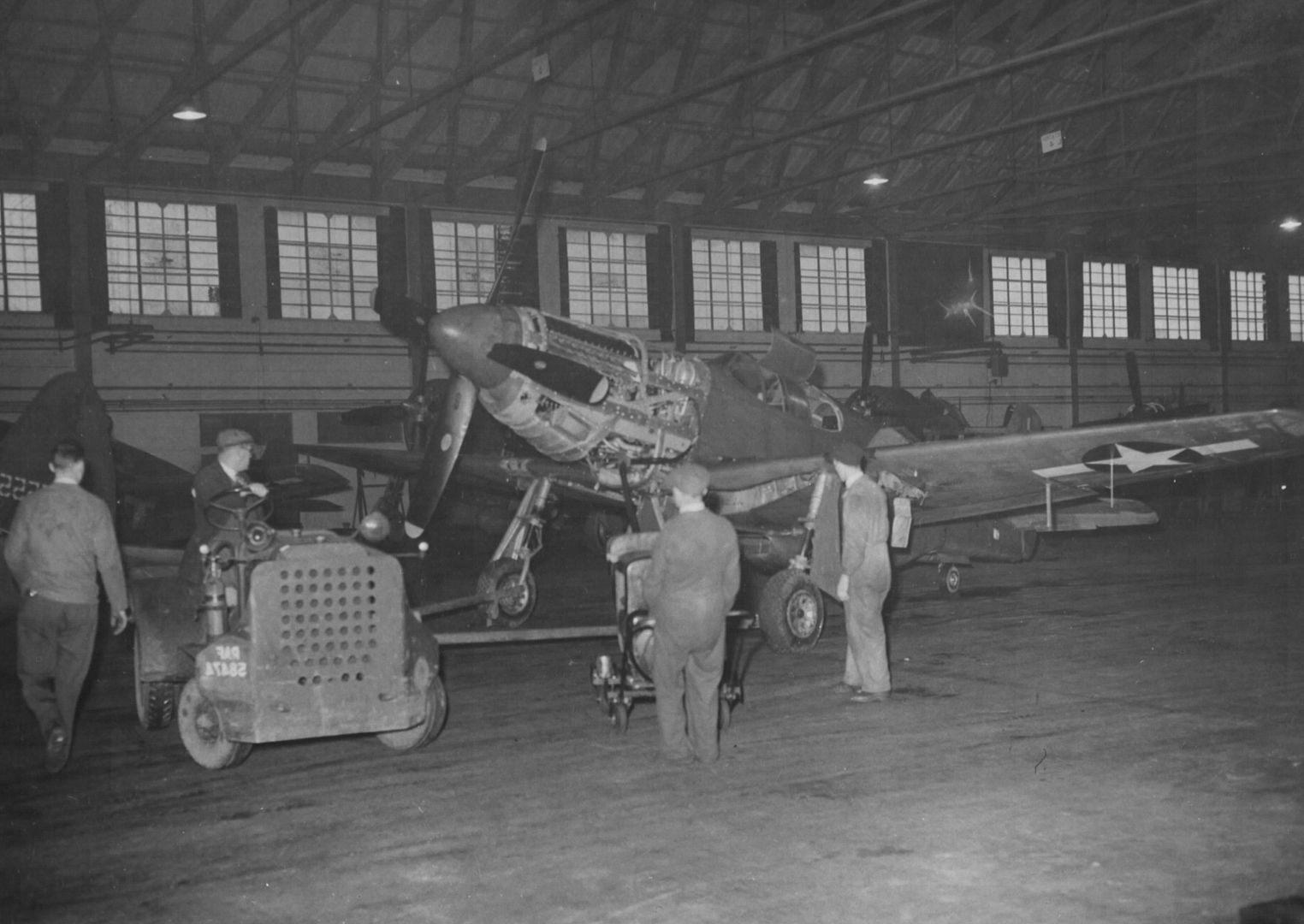 http://i262.photobucket.com/albums/ii120/Duggy009/Duggy009-1/P-51%20Is%20Moved%20Into%20A%20Hangar%20For%20Reassembly%20At%20The%20Lockheed%20Reassembly%20Plant%20At%20Liverpool%20England.%207%20December%201943..jpg