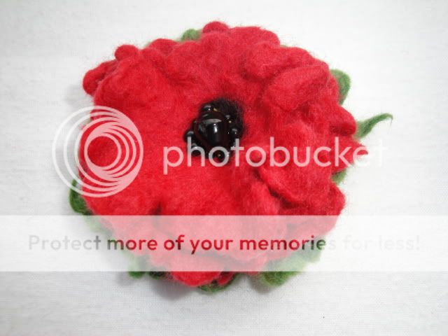 do flower brooches in lots of different colours, styles and sizes 